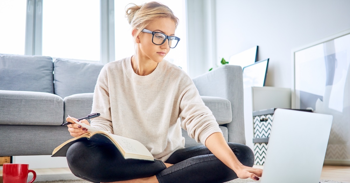 woman reviewing budget using laptop
