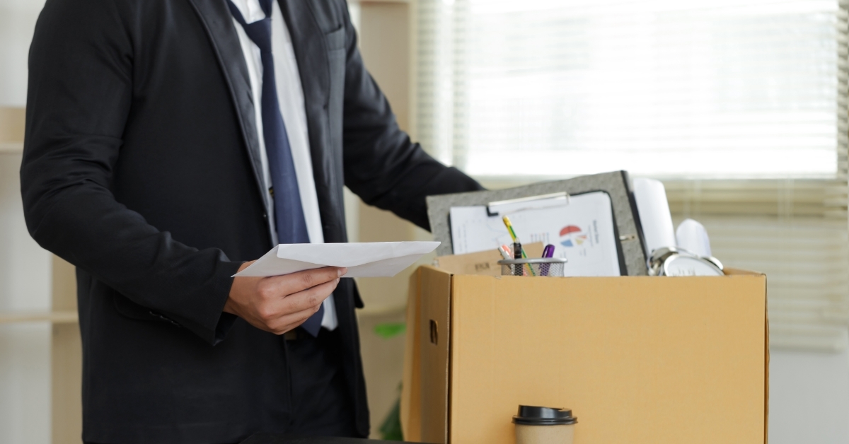 businessman packing belongings at office