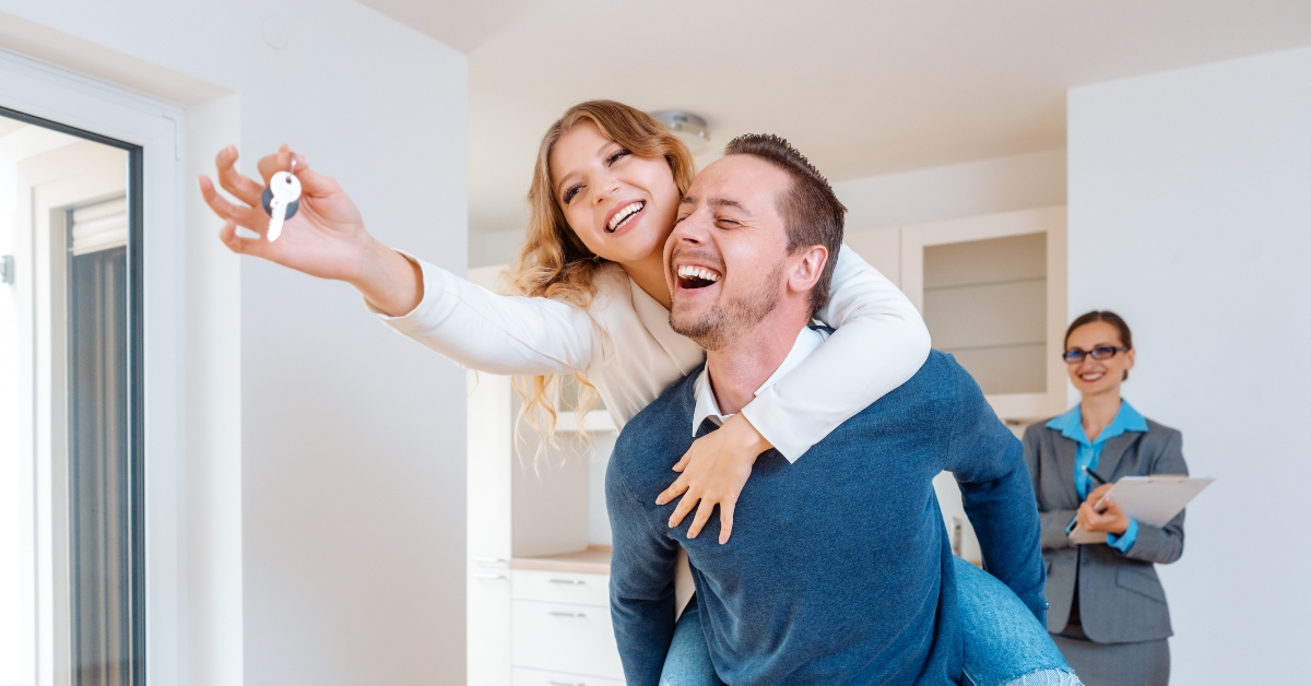 man carrying his wife piggyback