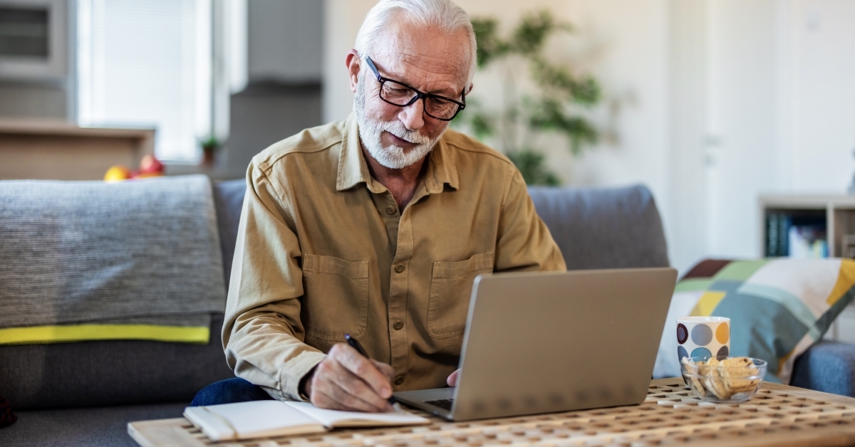 senior man reviewing pension at home