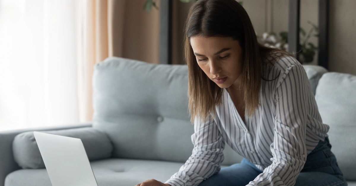 woman reviewing student loan online