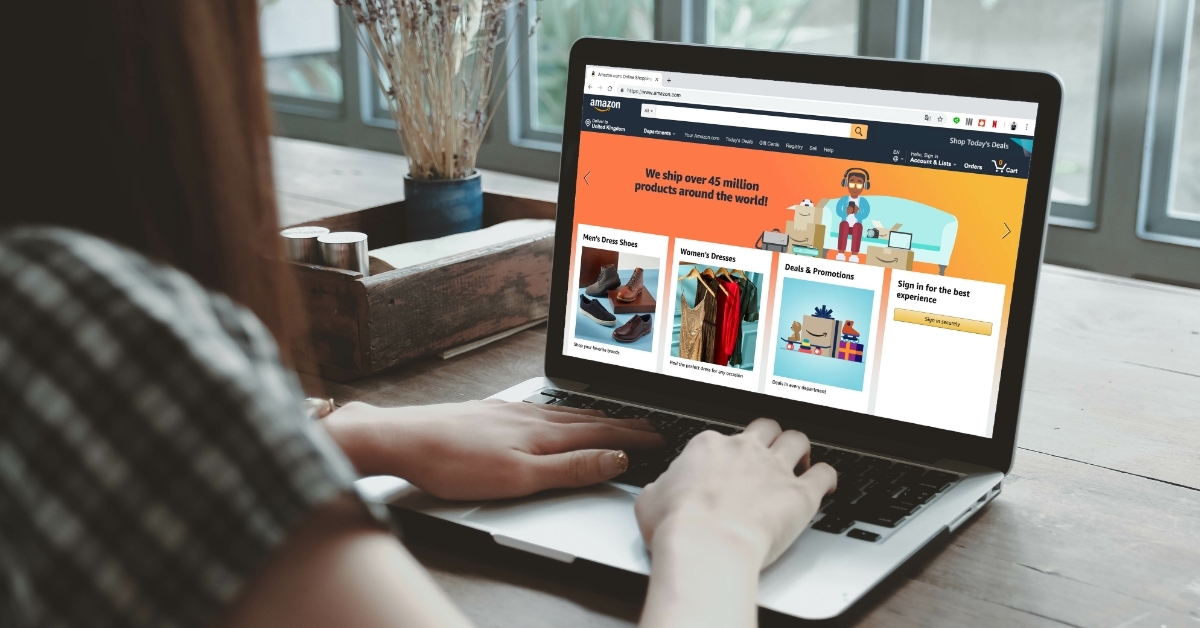 woman using amazon website on laptop