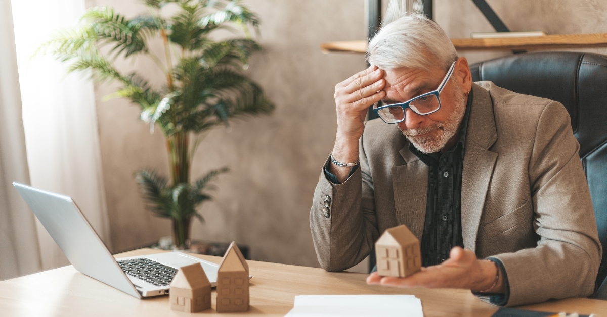 stressed senior man with mortgage issues 