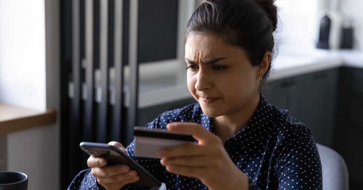 stressed woman shopping online using card