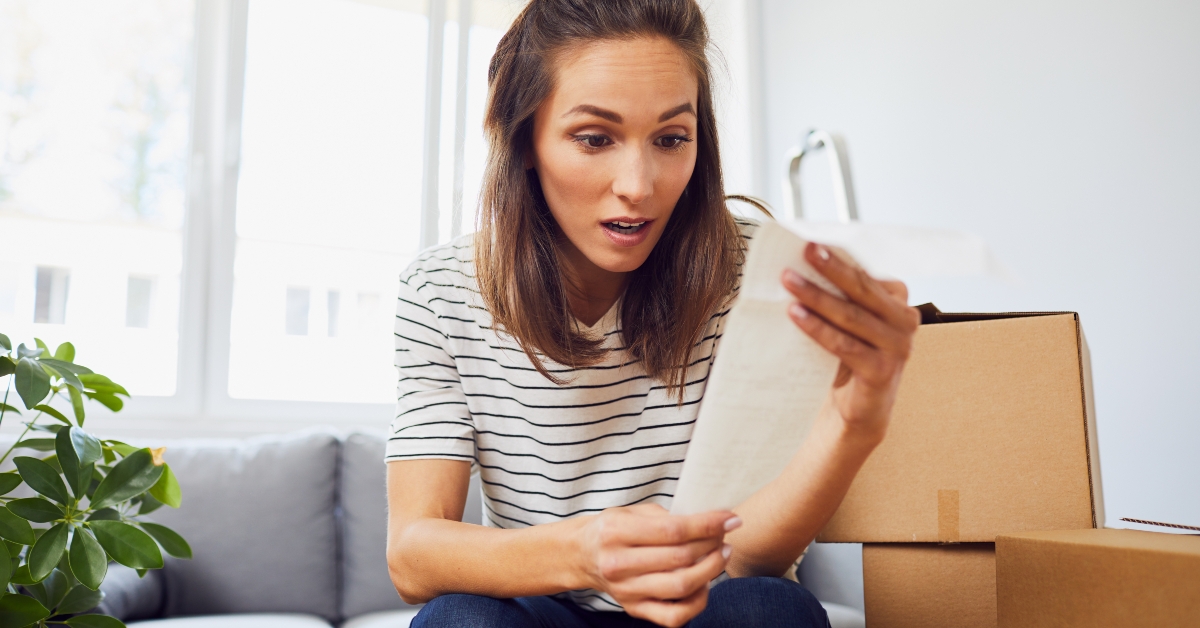 stressed woman looking at bill