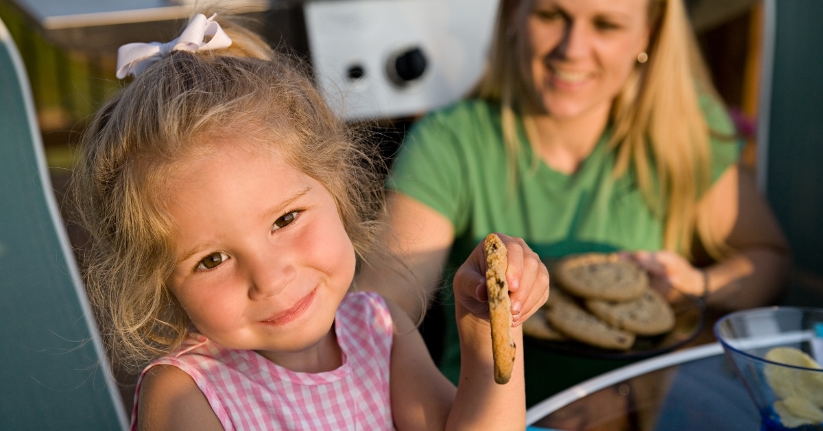 Girl eating Chocolate Chip Cookie