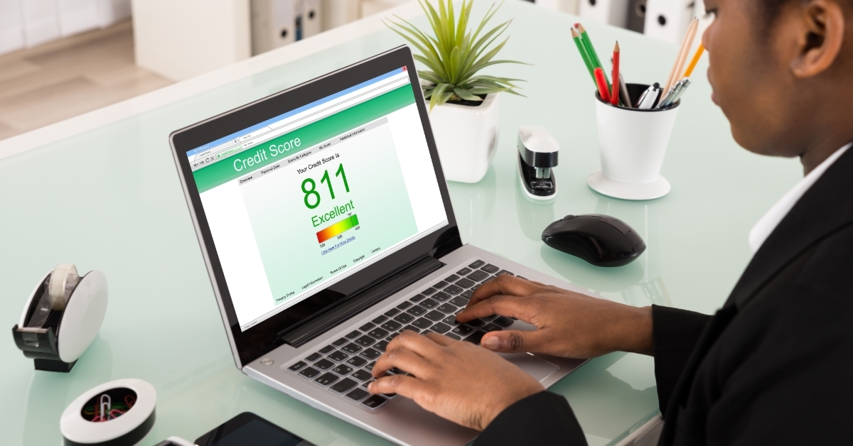 Business woman Checking Credit Score On Laptop