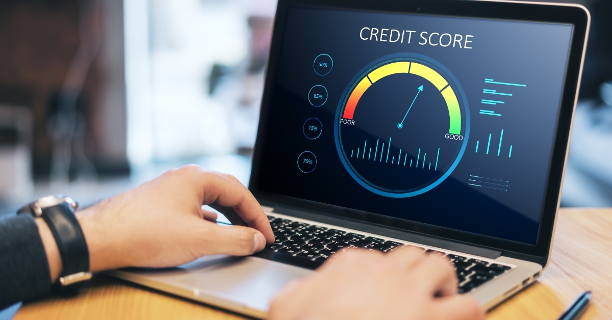 man checking credit score using laptop