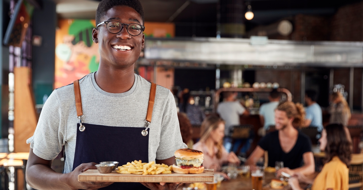 portrait of waiter serving food