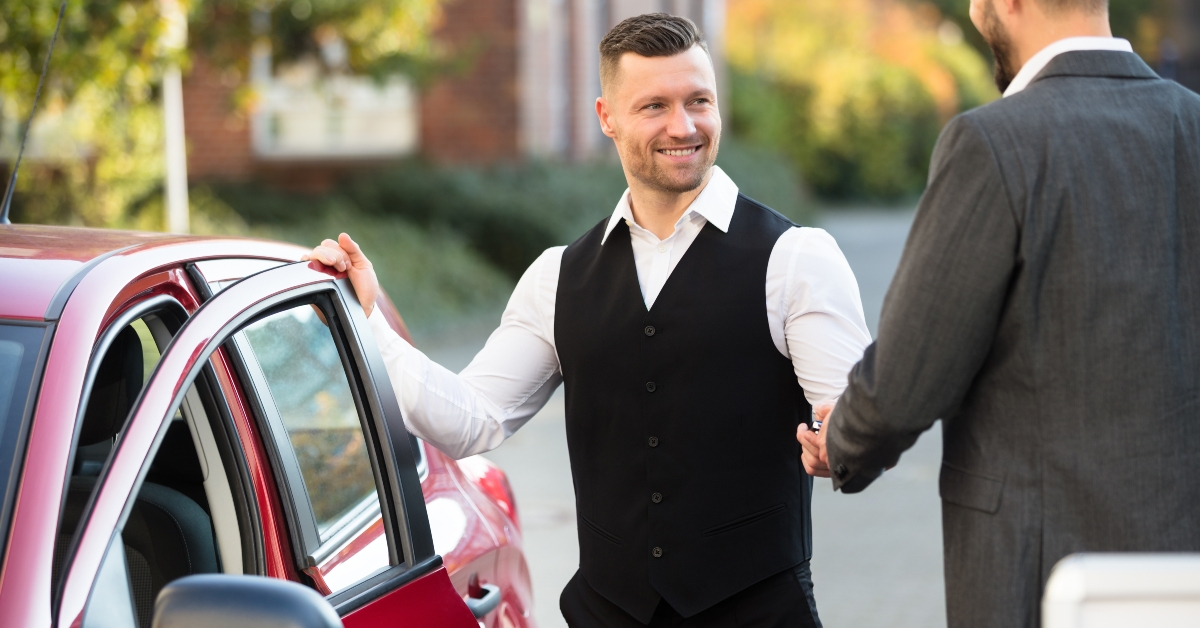 smiling valet and businessperson