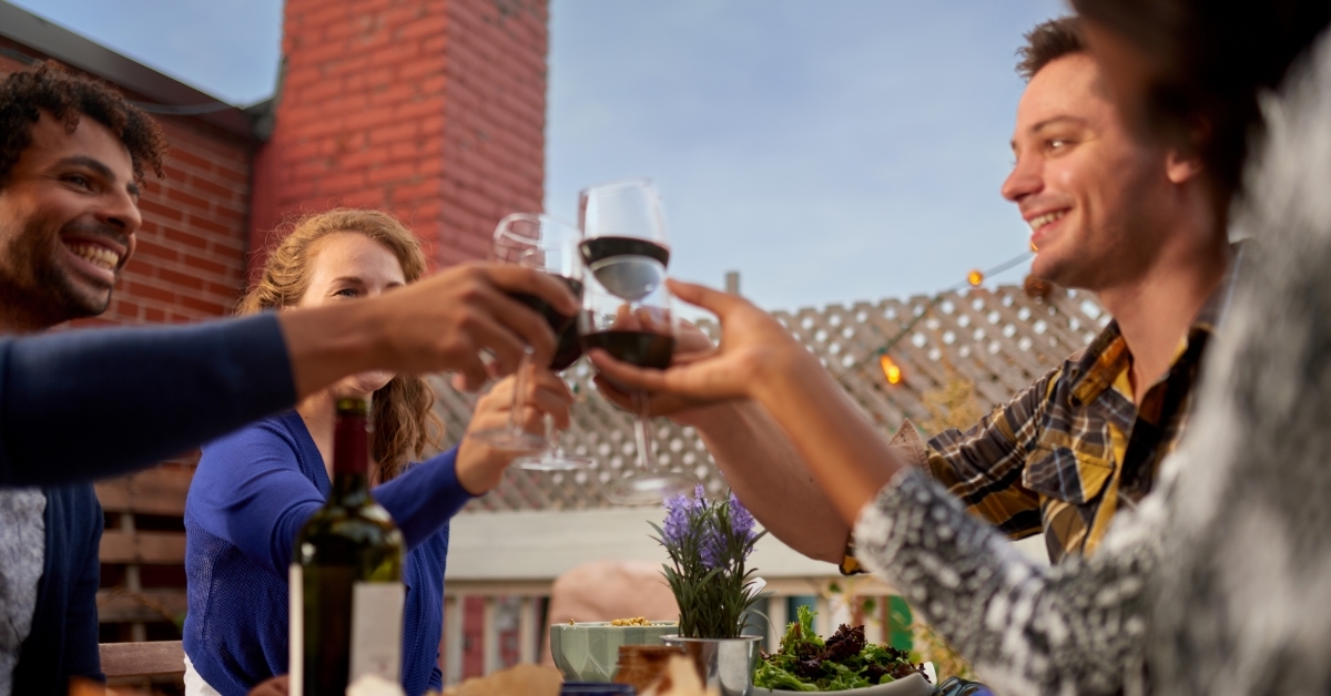friends having dinner at outdoor restaurant