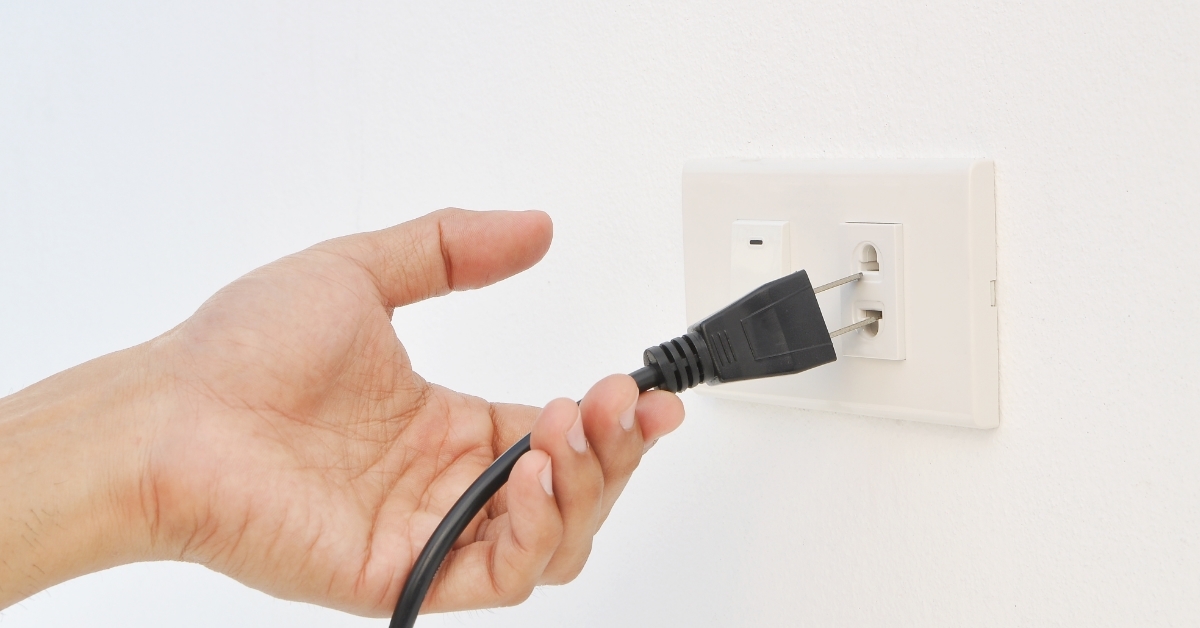 Hand unplugging switch from socket