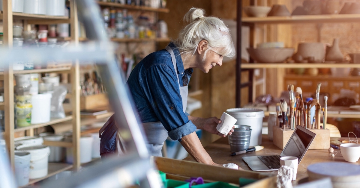 senior female pottery artist at studio