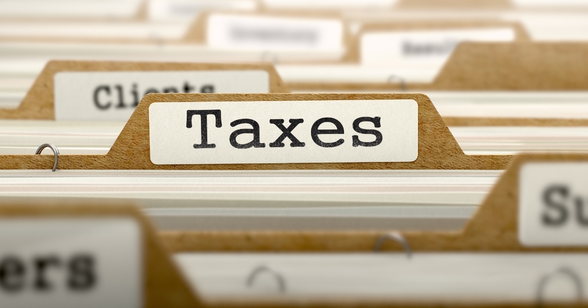 Taxes Concept with Word on Folder