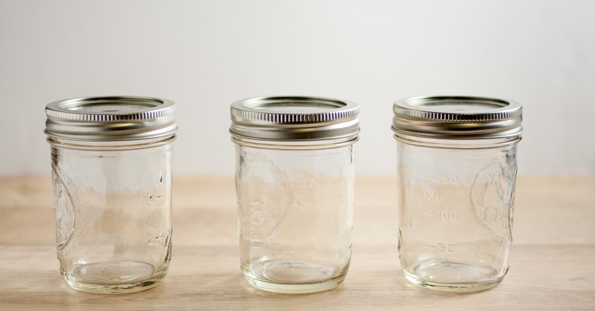 Empty canning jars on wooden tabletop