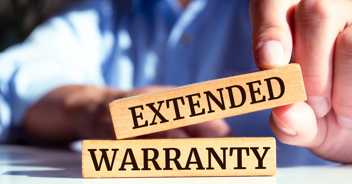 wooden blocks with words 'extended warranty'.