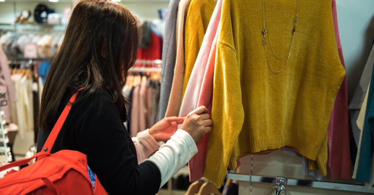 woman buying clothes at shopping center