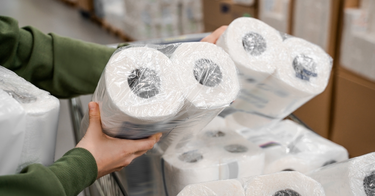 woman buying toilet paper in bulk