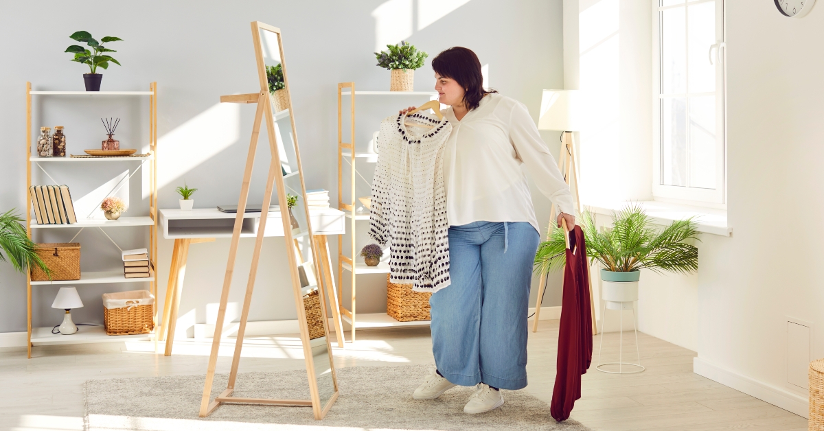 overweight woman looking at mirror
