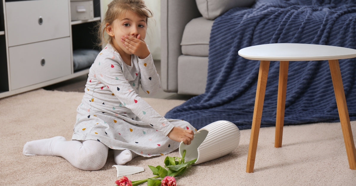 broken ceramic vase on floor