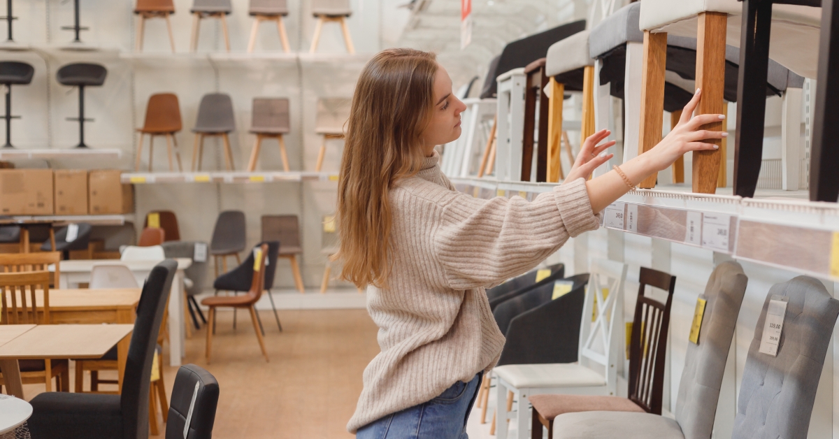woman chooses furniture for apartment