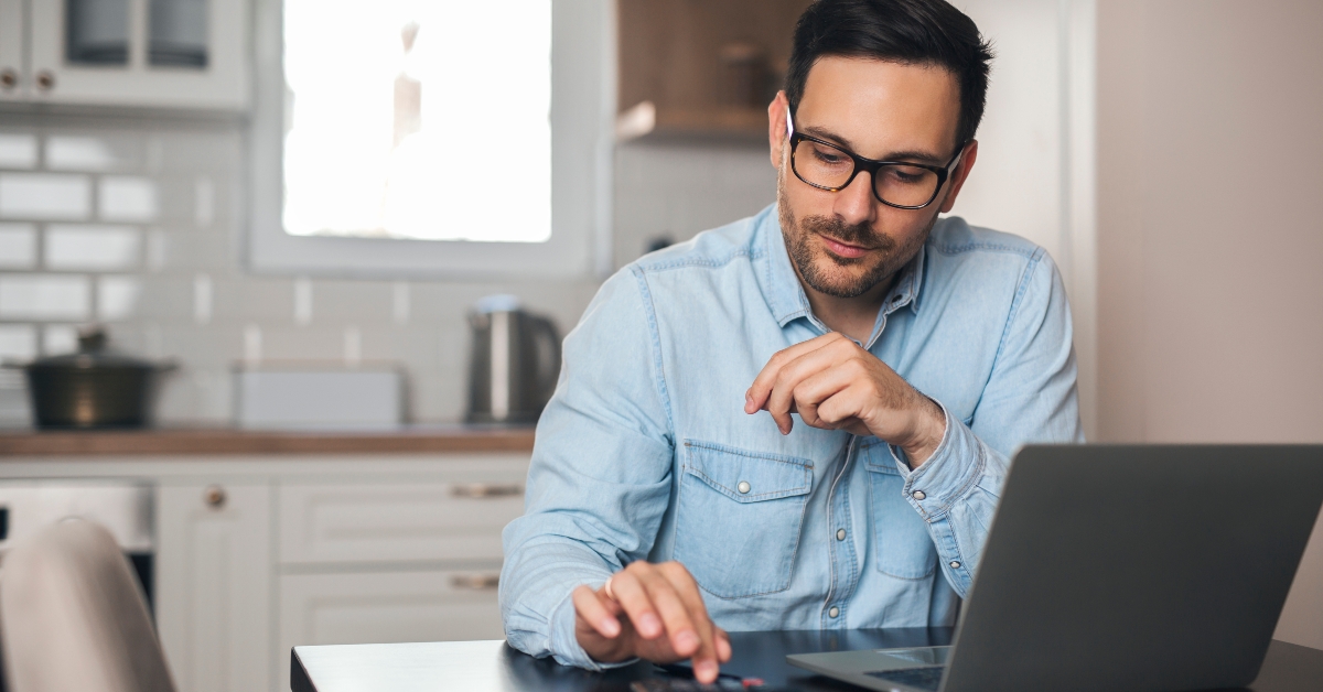 accountant using calculator at home