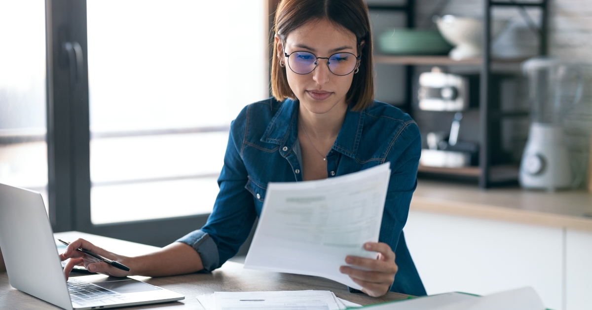 business woman consulting some invoices
