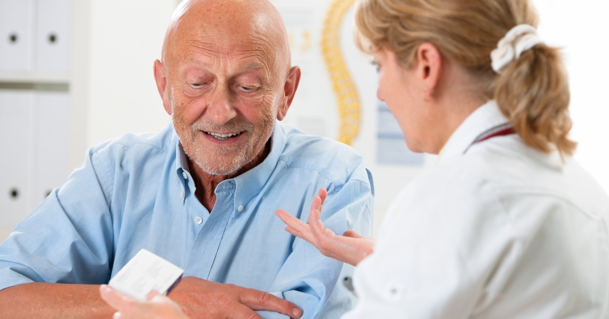 doctor prescribing medications to senior patient