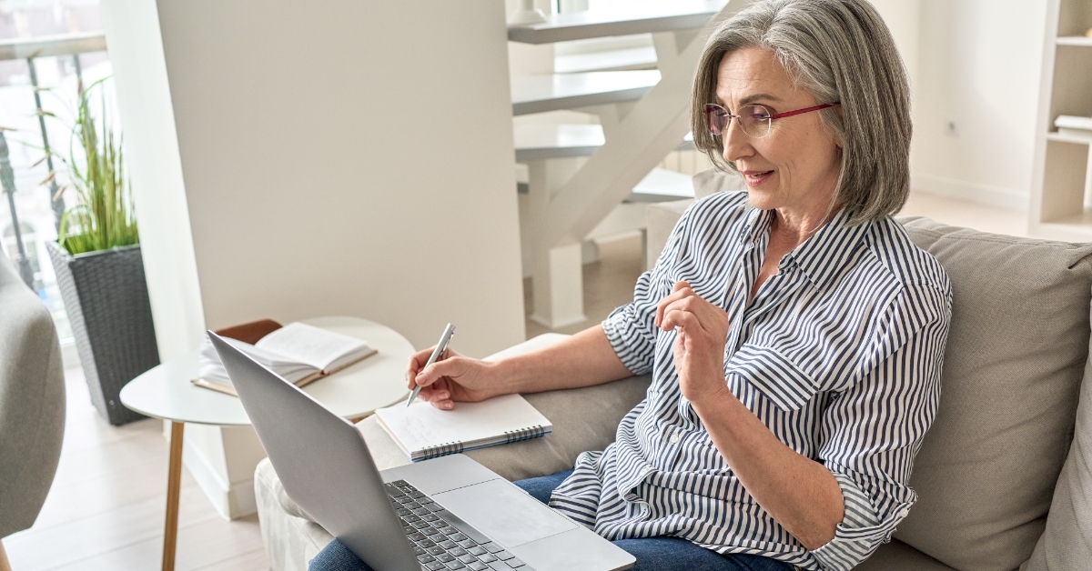 senior woman taking lessons from webinar