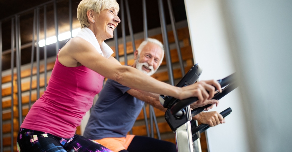 senior people doing exercises in gym
