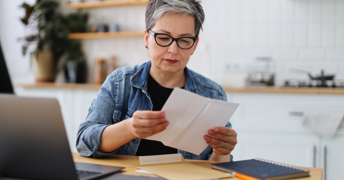upset mature woman reading