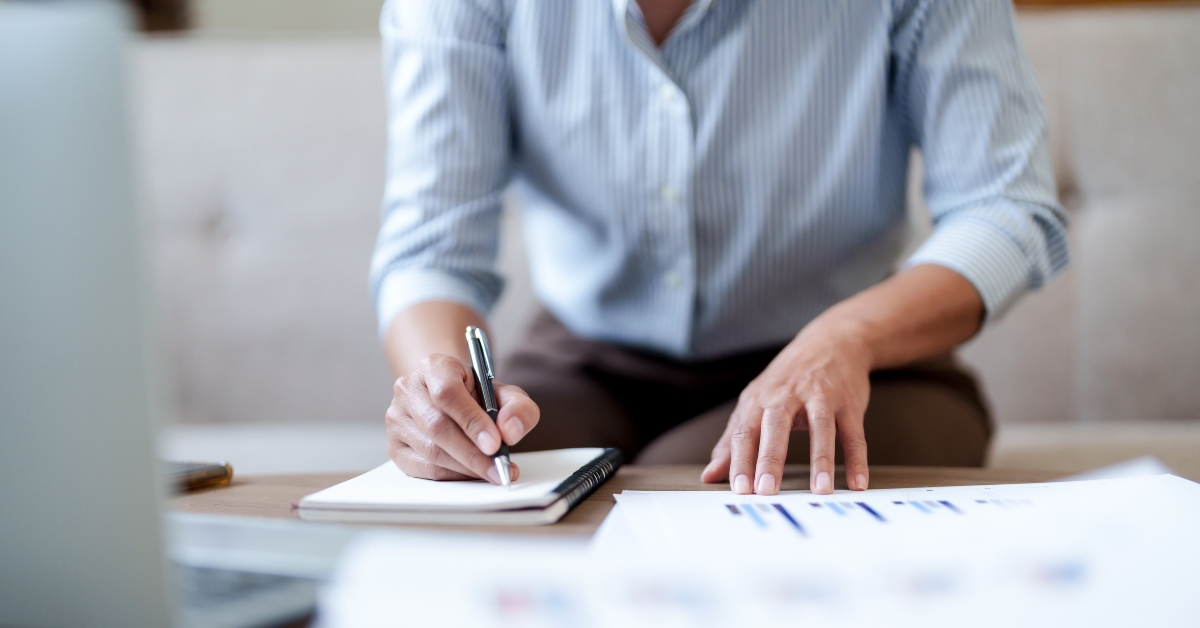 woman calculating monthly expenses