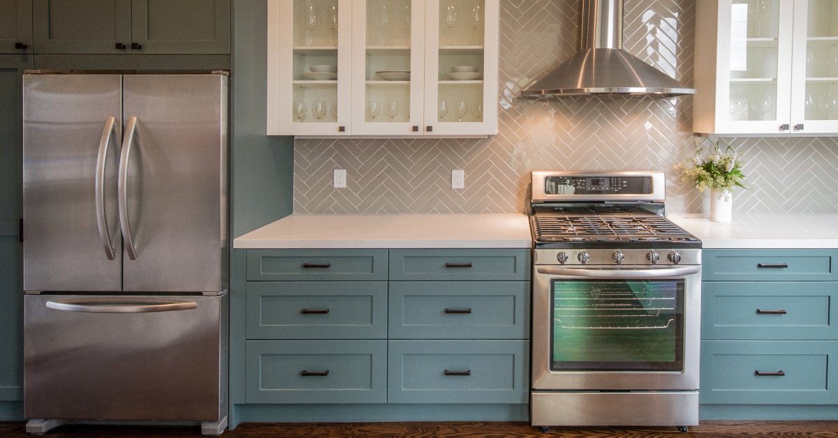 modern kitchen with teal base cabinets