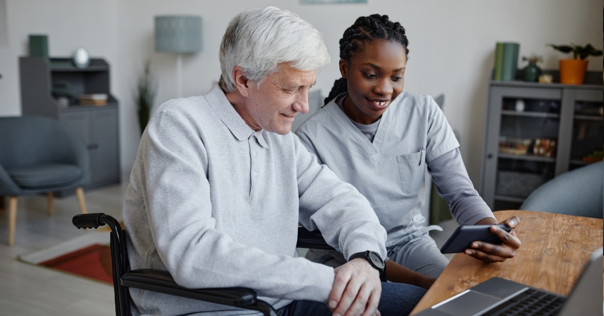 african american nurse helping senior man
