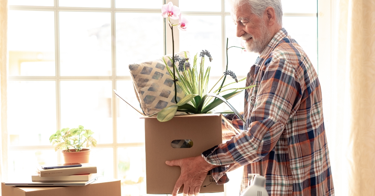senior man with cardboard box