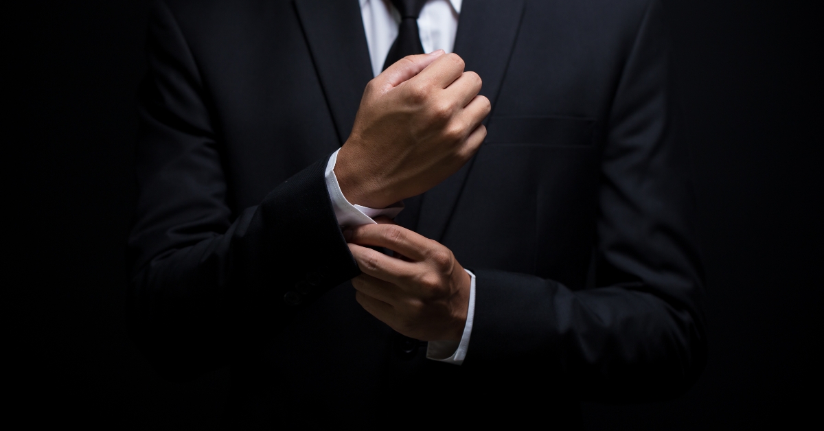 businessman adjusting his cufflinks