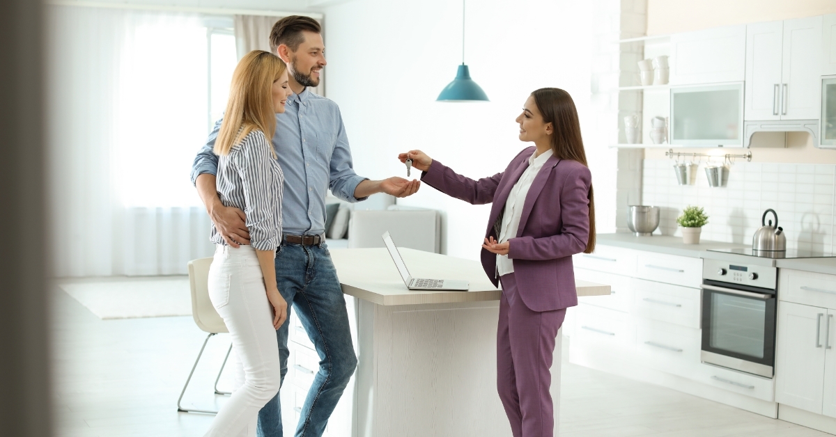real estate agent giving keys