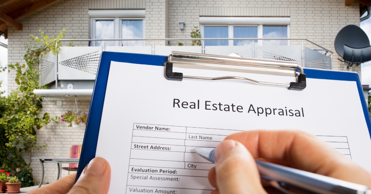 hand filling real estate appraisal form