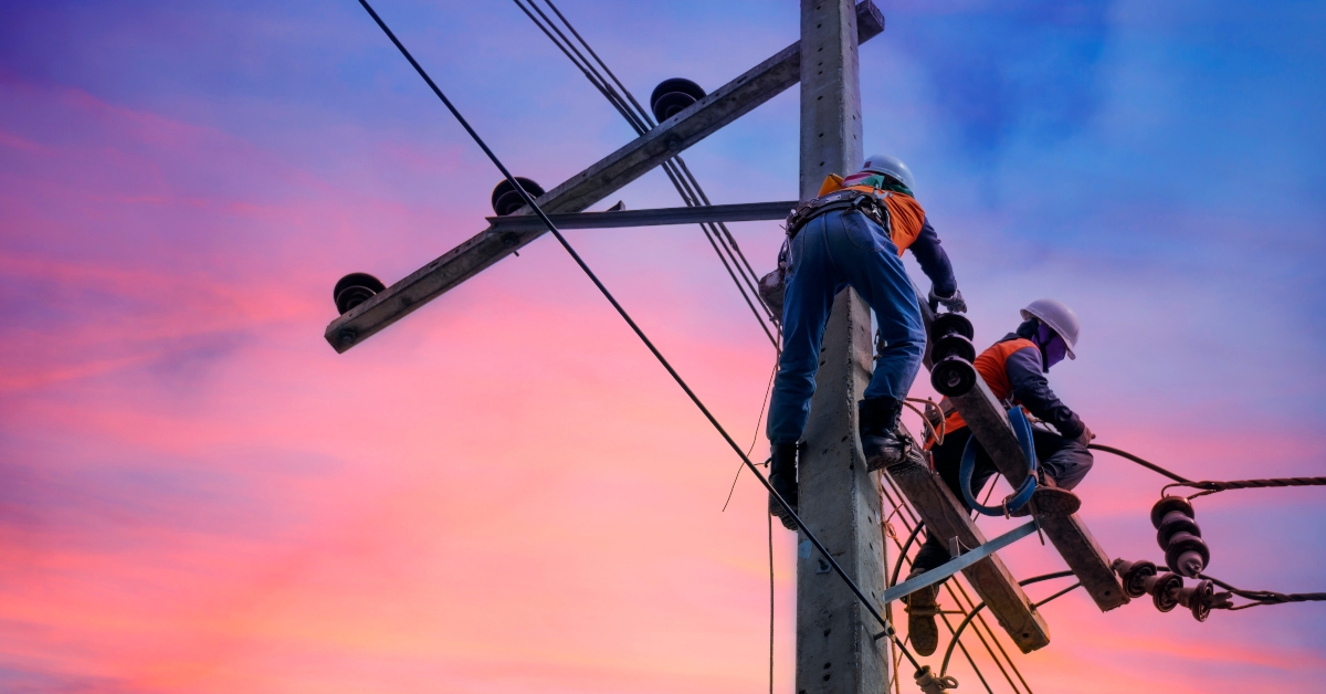 linemen on electric power pole
