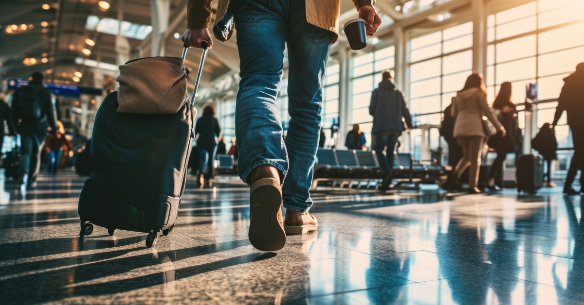 person walking through airport terminal