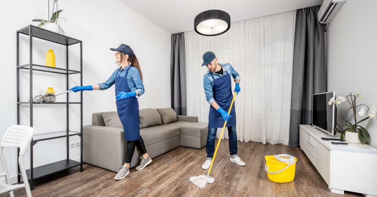 Professional cleaners cleaning house