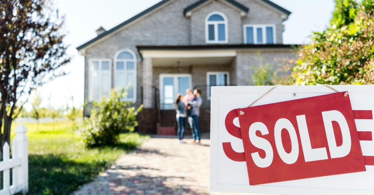 sold sign board outside house
