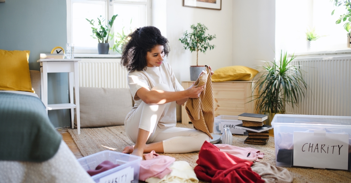 woman sorting wardrobe indoors at home