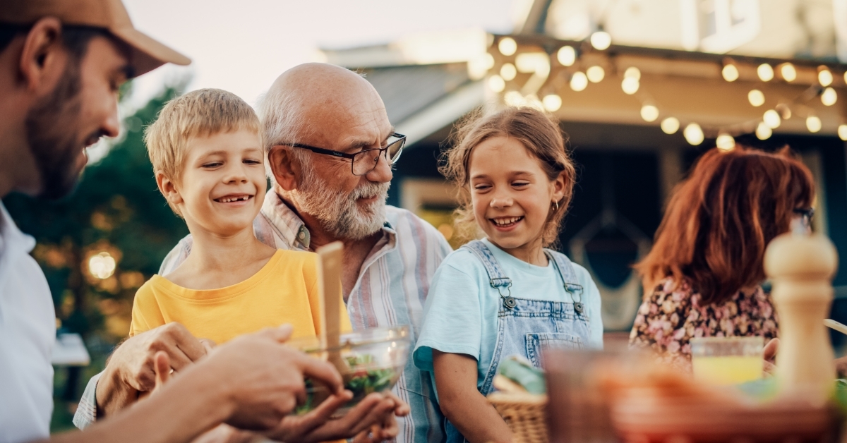 Grandfather Talking with Grandchildren at gathering