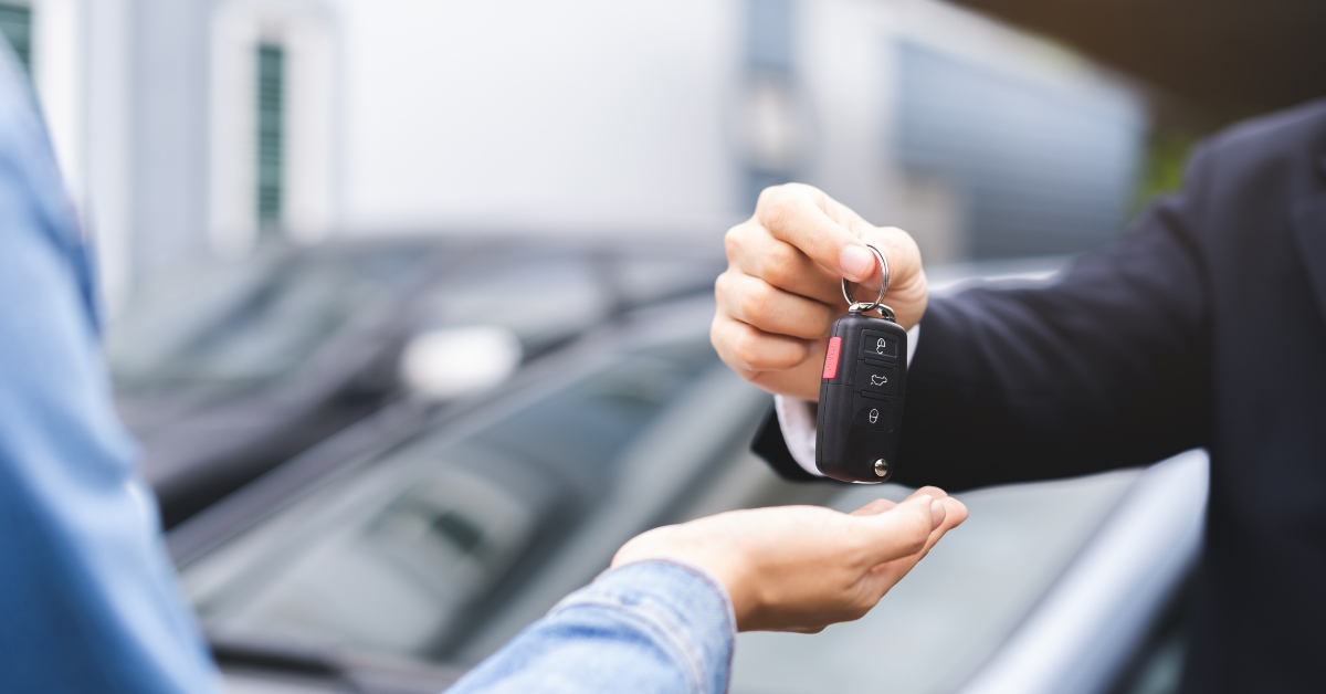 sale man giving auto key