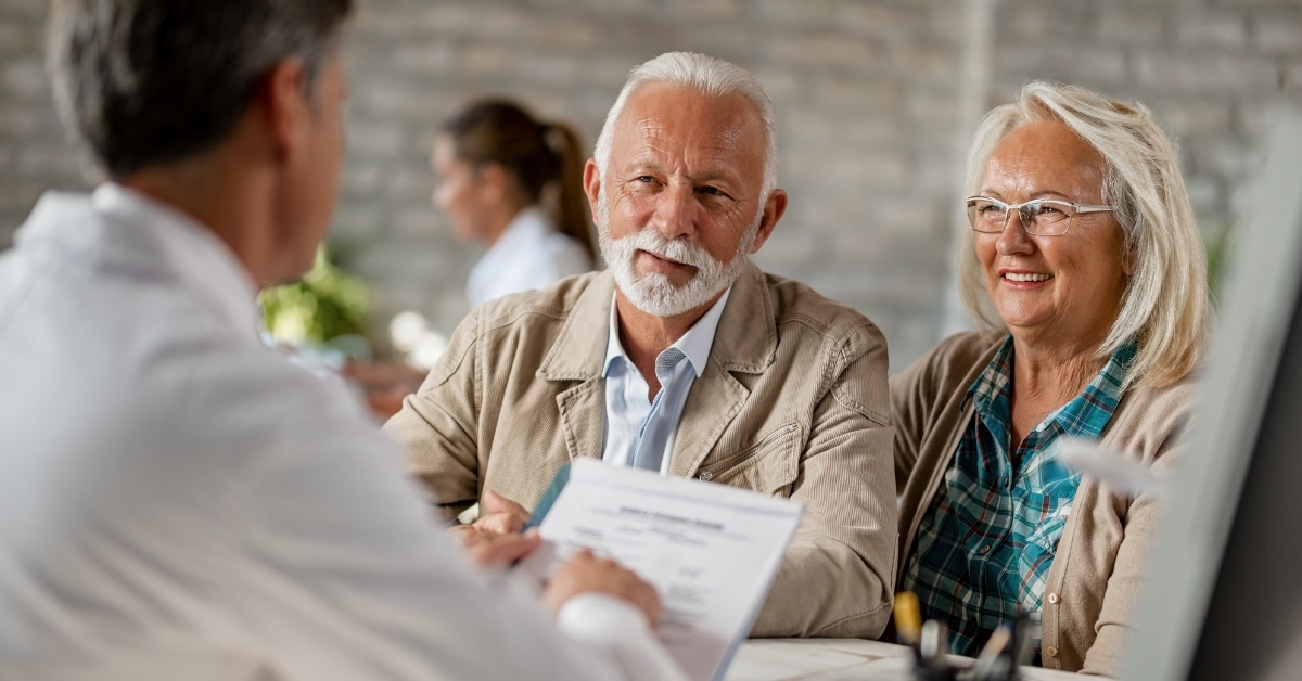 senior couple doing medical insurance paperwork