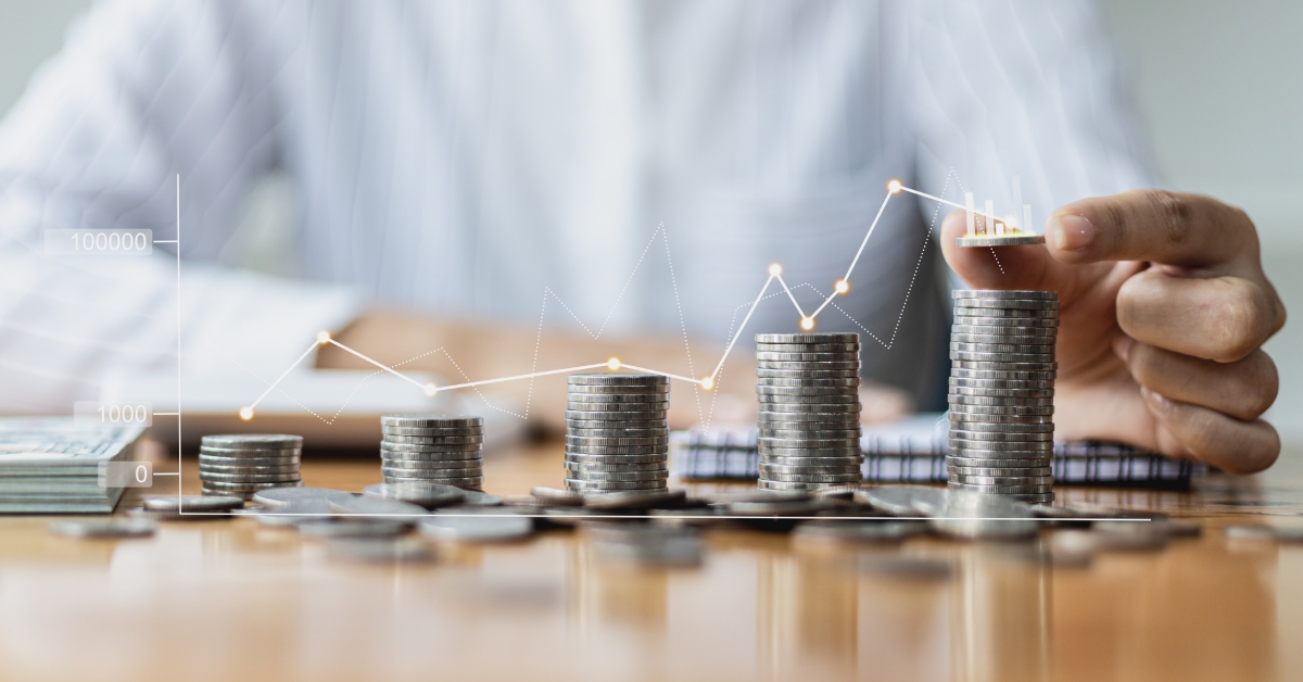 putting a coin on a pile of coins