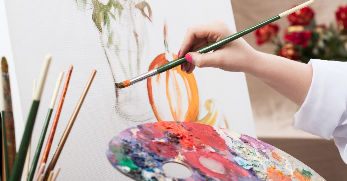 female artist painting picture