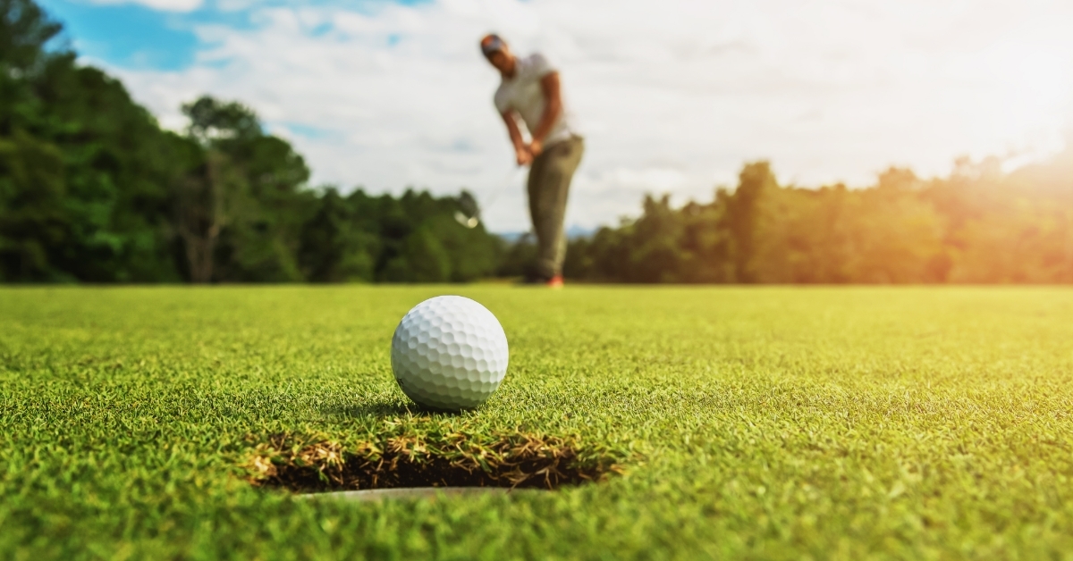 man playing golf at golf club