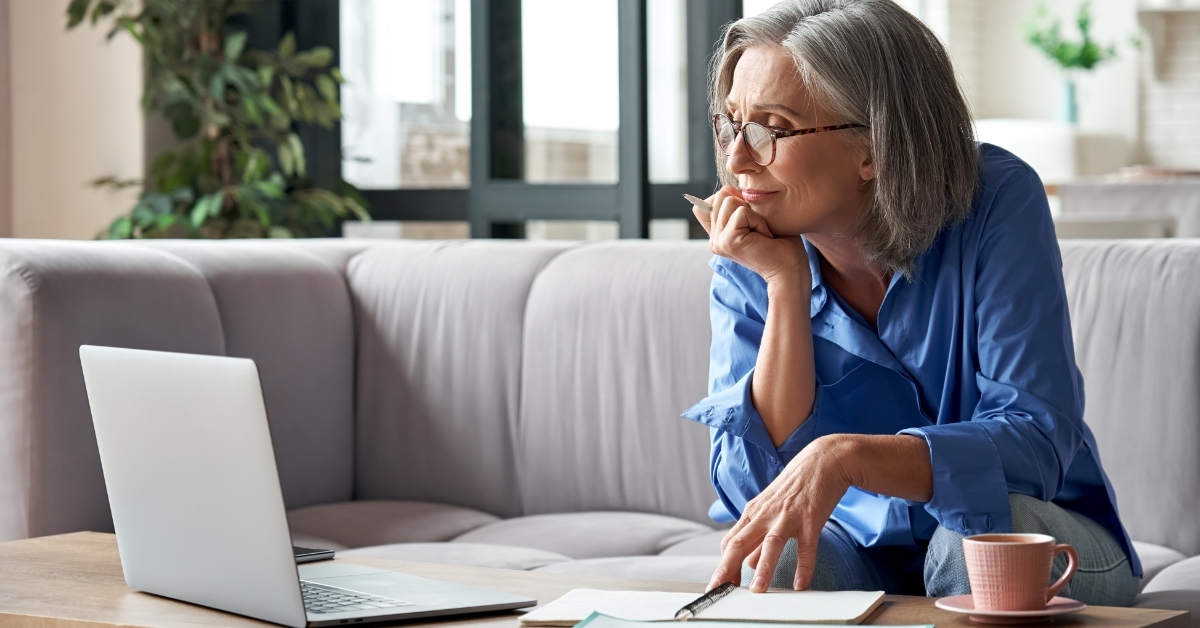 senior woman attending webinar online